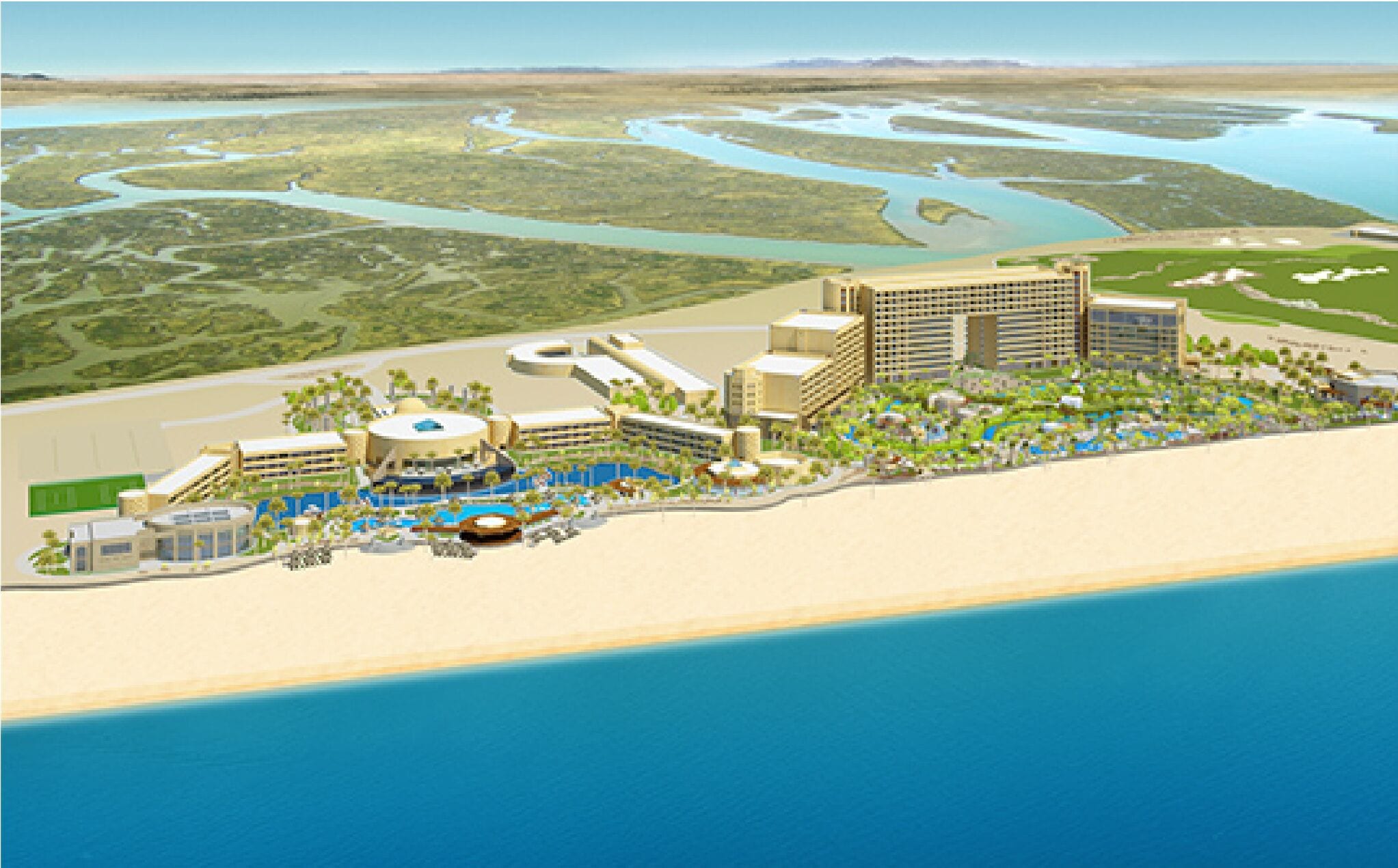Ein Küstenresort mit mehreren Gebäuden, einem Strand und einer Marina.