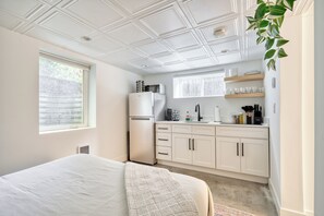 Studio sleeping area looking toward the kitchenette. - Compact Retreat - Great Value - Prime NE Area (Portland)