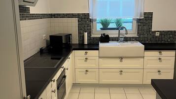 Microwave, stovetop, coffee/tea maker, cookware/dishes/utensils