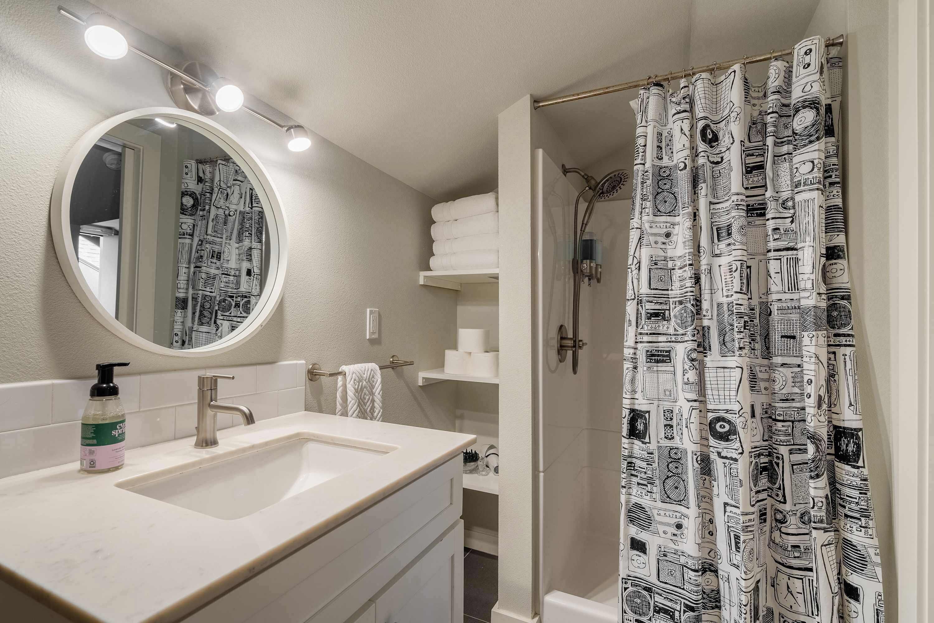 Shower, hair dryer, towels, shampoo