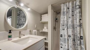 Shower, hair dryer, towels, shampoo