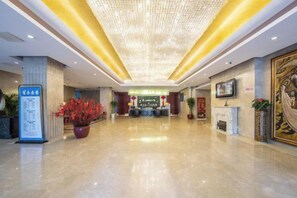 A spacious lobby with a polished floor, a reception desk, and a chandelier. - Ordos Aili Hotel (Beijing Jinbao Street) (Beijing)