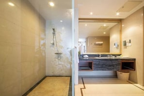A modern bathroom with a shower, a vanity with a marble countertop, and a large mirror. - Ordos Aili Hotel (Beijing Jinbao Street) (Beijing)