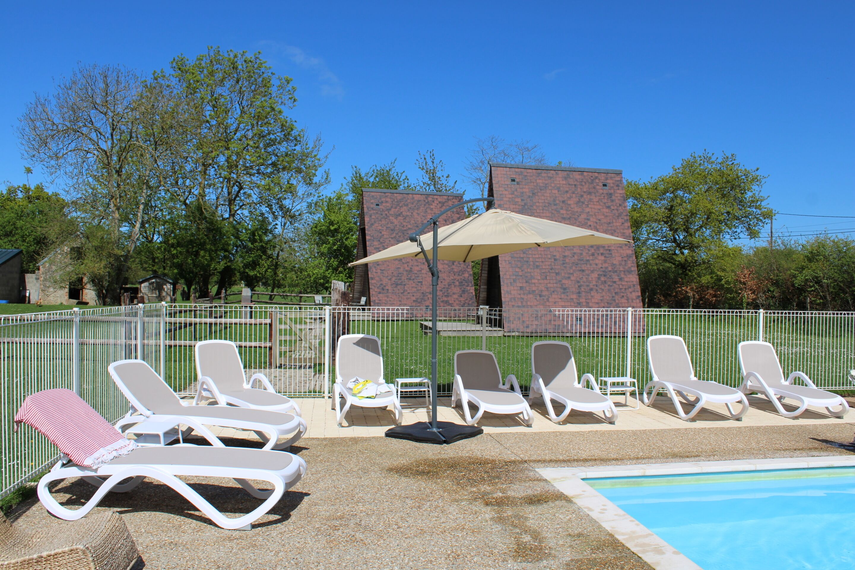 Indoor pool, seasonal outdoor pool, pool umbrellas, pool loungers