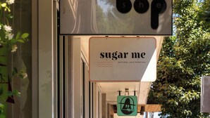 A storefront with a sign that reads "sugar me" and "natural hair removal". - 1920s Farmhouse | 4BR/2BA | Foodie District (Portland)