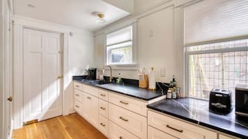 Fridge, coffee/tea maker, cookware/dishes/utensils