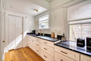 Fridge, coffee/tea maker, cookware/dishes/utensils