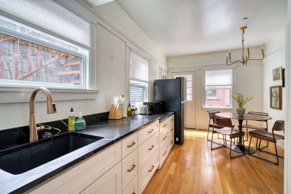 Fridge, coffee/tea maker, cookware/dishes/utensils