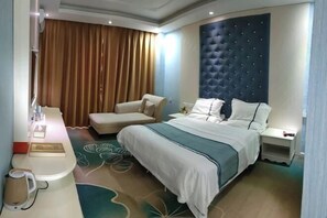 A hotel room with a bed, a chair, a bedside table, and a large window with curtains. - Cangjiang Mingzhu Hotel (Yun County)