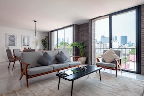 Apartment, 2 Bedrooms, Balcony (8) | Living area | 40-inch Smart TV with cable channels, heated floors