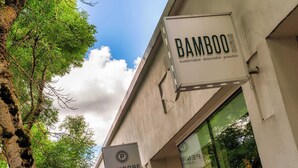 A building with signs for 'Bamboo' and 'Penrose Candles'. - Tiny Retreat • Walk to Bars, Food & Local Art (Portland)