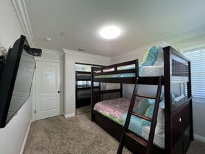A room with bunk beds, a door, and a ceiling light. - Awesome 4 Bedroom, 3 1/2 Bath Home 1/2 Mile Walk To Disney (Anaheim)