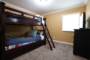 A bunk bed with a ladder, a dresser, and a window with blinds. - Classy 4 Bedroom 3 Bath Pool Home 3/4 Mile Walk To Disney (Anaheim)