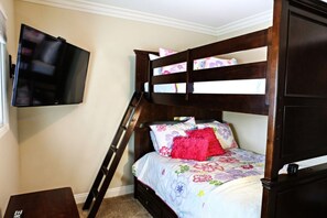 A bunk bed with a TV mounted on the wall, a ladder, and a small table. - Wonderful 4 Bedroom 3 Bath Pool Home 3/4 Mile To Disney (Anaheim)