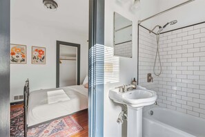 Shower, hair dryer, towels, shampoo