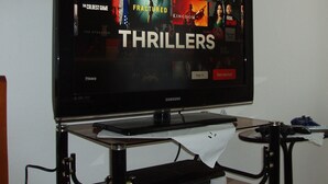 A television displaying a selection of thriller movies. - Friendly Hostel (Gjirokaster)