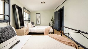 A bedroom with two beds, a bedside table, a mirror, a framed picture, and a window with blinds. - Moab Vibes in PDX - Walk to Local Coffee & Food (Portland)