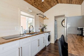 Fridge, stovetop, dishwasher, coffee/tea maker