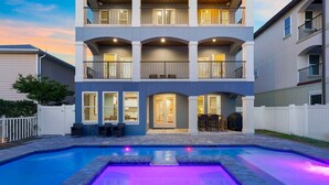 A multi-story residential building with a swimming pool.