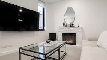 Apartment, 3 Bedrooms | Living area | Smart TV, fireplace