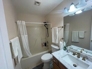 Shower, hair dryer, towels, soap