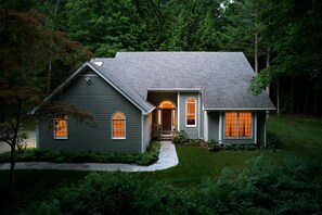 A two-story house with a sloped roof, a front porch, and a well-maintained lawn. - Perfect Nature Haven In Great Barrington (Great Barrington)