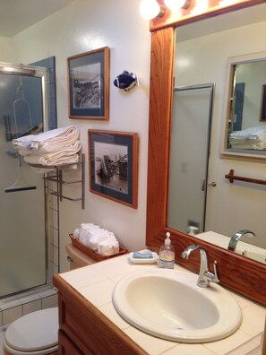Shower, hair dryer, towels, soap