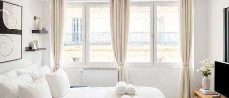 1 bedroom, desk, iron/ironing board, travel crib