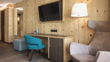 Junior Suite Lifestyle | Minibar, desk, laptop workspace, soundproofing