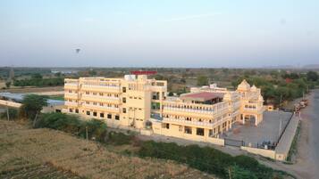 Situated in a rural setting, this traditional building offers stunning views of open fields and surrounding landscape.