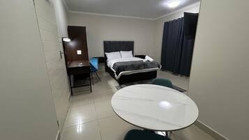 Deluxe Single Room | Living area | 42-inch Smart TV with digital channels, streaming services