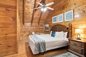 Rest easy in one of the cabin's inviting guest rooms. - 5BR Cabin with Views, Hot Tub, Seasonal Pool, Game Room, and Dog Friendly (Pigeon Forge)