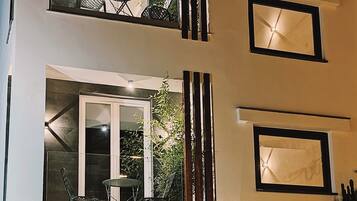 Experience the perfect blend of modern style and comfort in this two-story building with expansive windows and balconies.