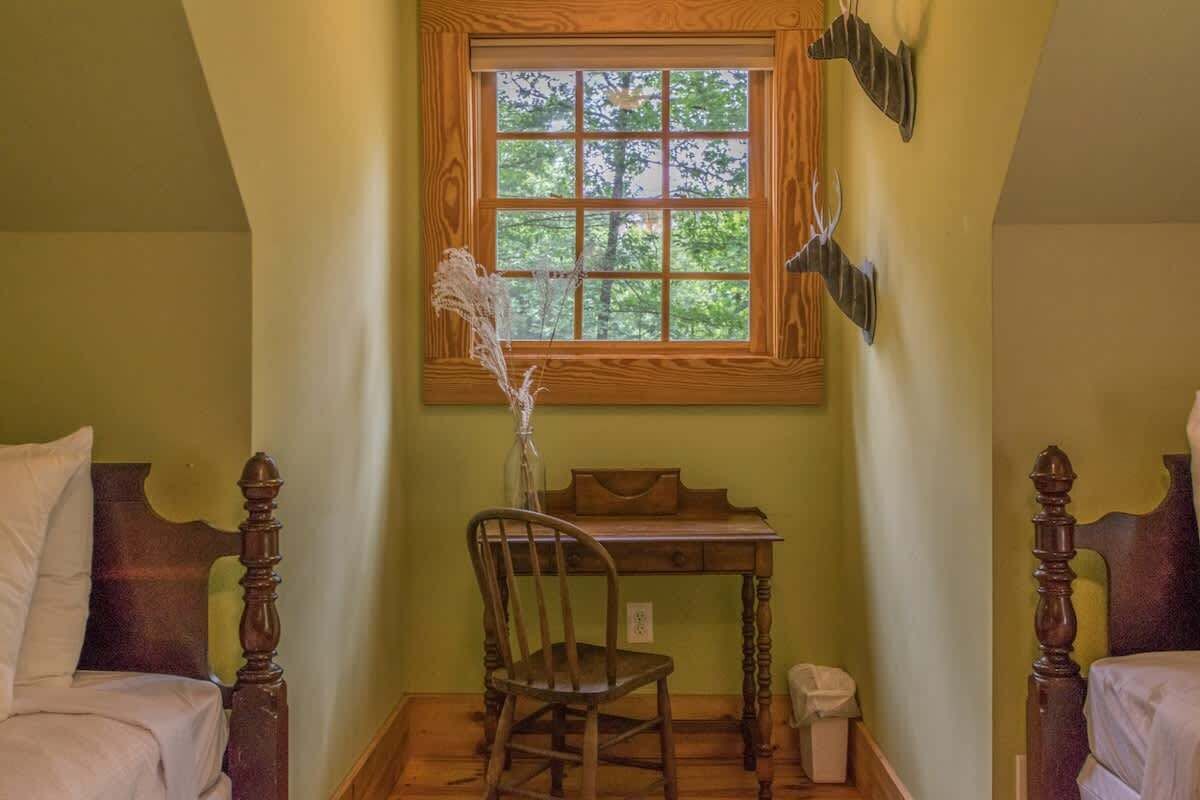 Desk available in the bedroom with twin beds.