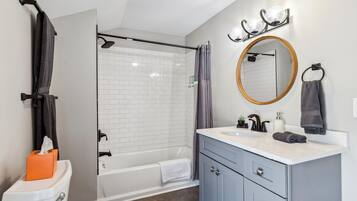 Shower, hair dryer, towels, shampoo