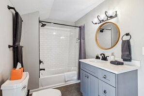 Shower, hair dryer, towels, shampoo