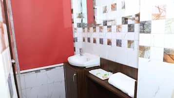 Shower, rainfall showerhead, towels, soap