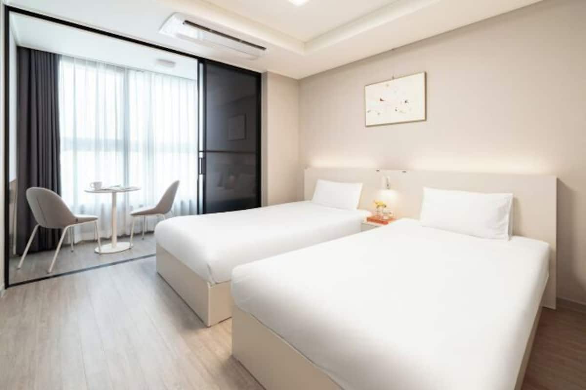 Desk, laptop workspace, blackout drapes, soundproofing