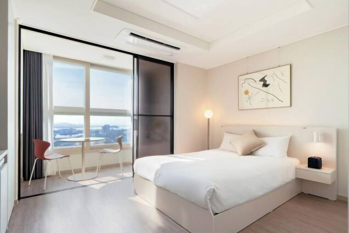 Desk, laptop workspace, blackout drapes, soundproofing