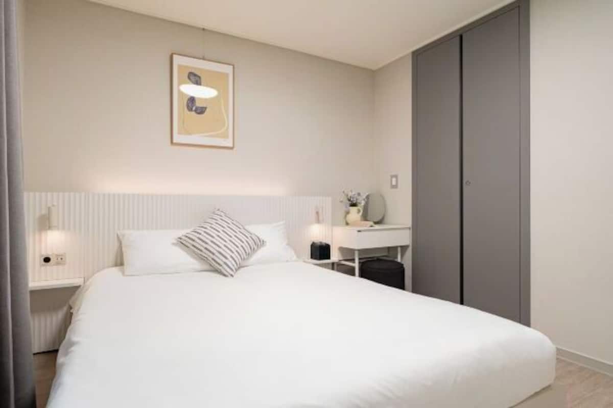 Desk, laptop workspace, blackout drapes, soundproofing