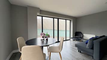 Deluxe Apartment | Living area | 40-inch flat-screen TV with cable channels