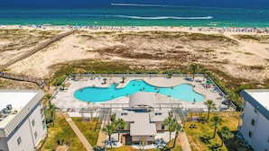 A resort with a pool area, beach access, and ocean views. - Beachy Gulf Shores Condo w/ Pool, Walk to Shore! (Gulf Shores)