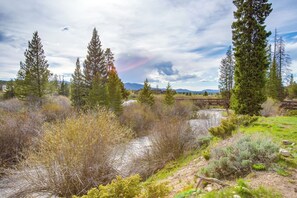 A river with surrounding vegetation and a bridge in the background. - Hike, Bike, Ski: Winter Park Condo w/ Deck (Winter Park)