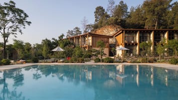 Seasonal outdoor pool, pool umbrellas, pool loungers