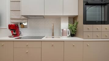 Dishwasher, coffee/tea maker, cookware/dishes/utensils