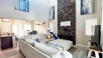 Smart TV, fireplace, books, stereo