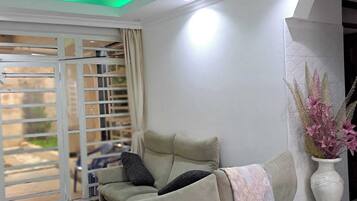 Comfort House, Garden View | Living area | 24-inch Smart TV with digital channels