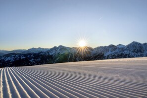 Surrounded by untouched snow-covered mountains, this serene landscape offers breathtaking views.
