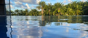 Cozy 2-bedroom hotel with AC and WiFi in enchanting Tela