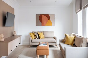 Executive One Bedroom Duplex Suite | Living area | 43-inch LCD TV with digital channels